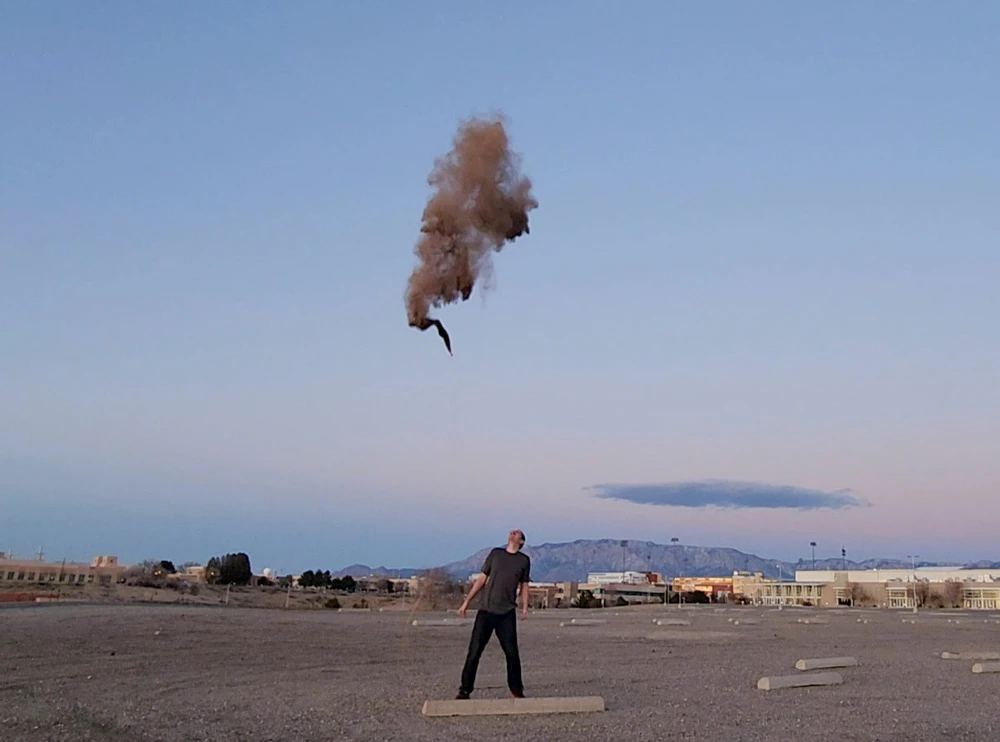 An early attempt at creating an artificial dust cloud