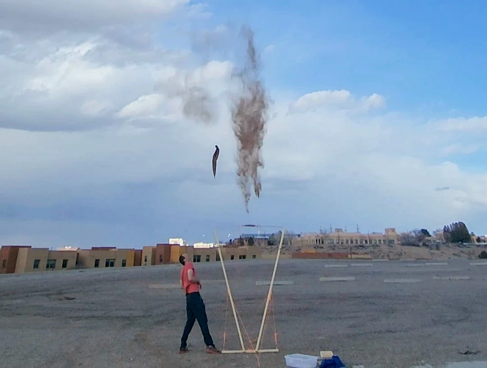 Testing a giant slingshot I created for launching dust